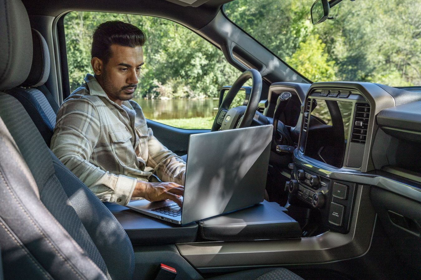 2024 Ford F-150 Interior Cabin with Driver Doing Work