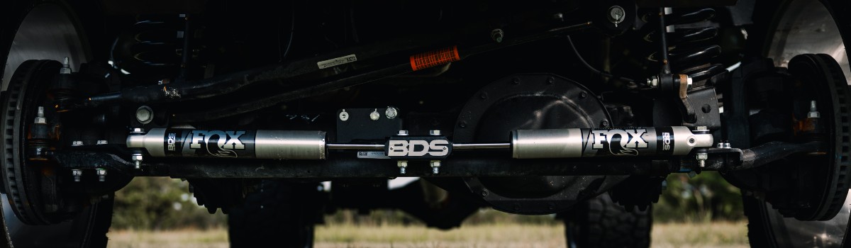 Custom Pearl RAM 3500 Exterior FOX Suspension System Close Up