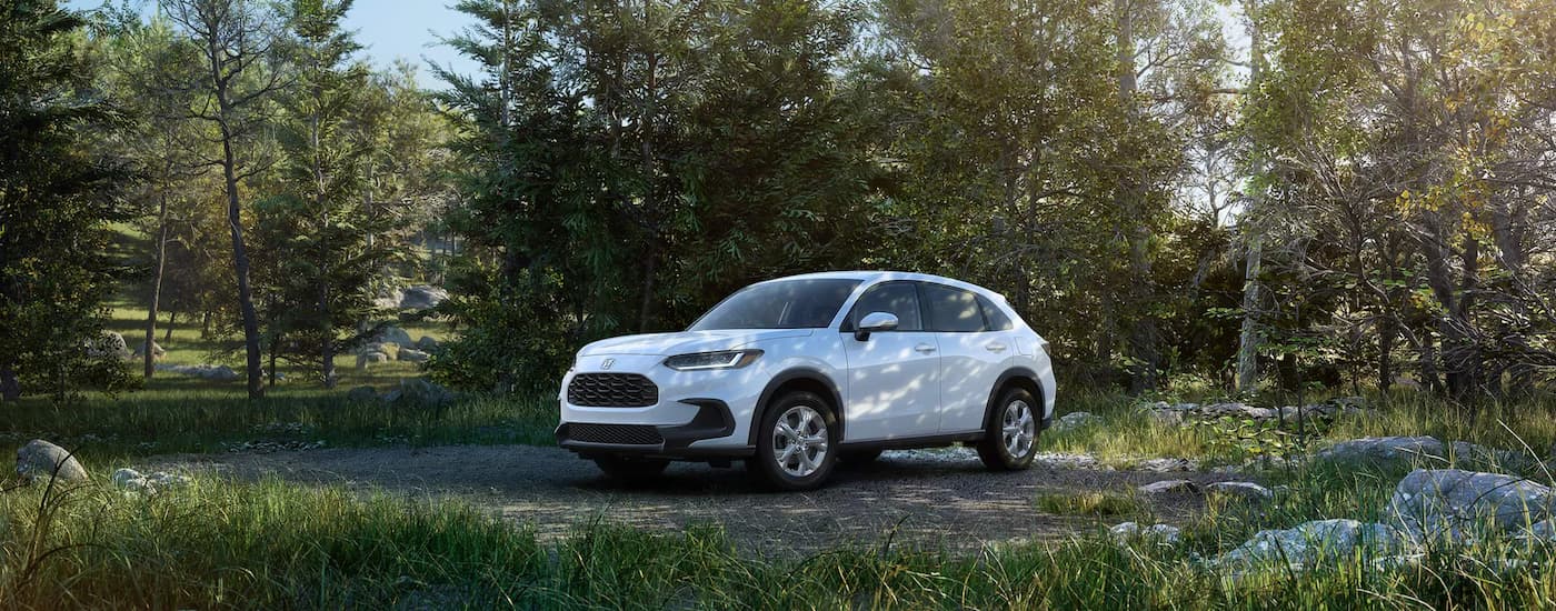 White 2023 Honda HR-V parked in a grassy field