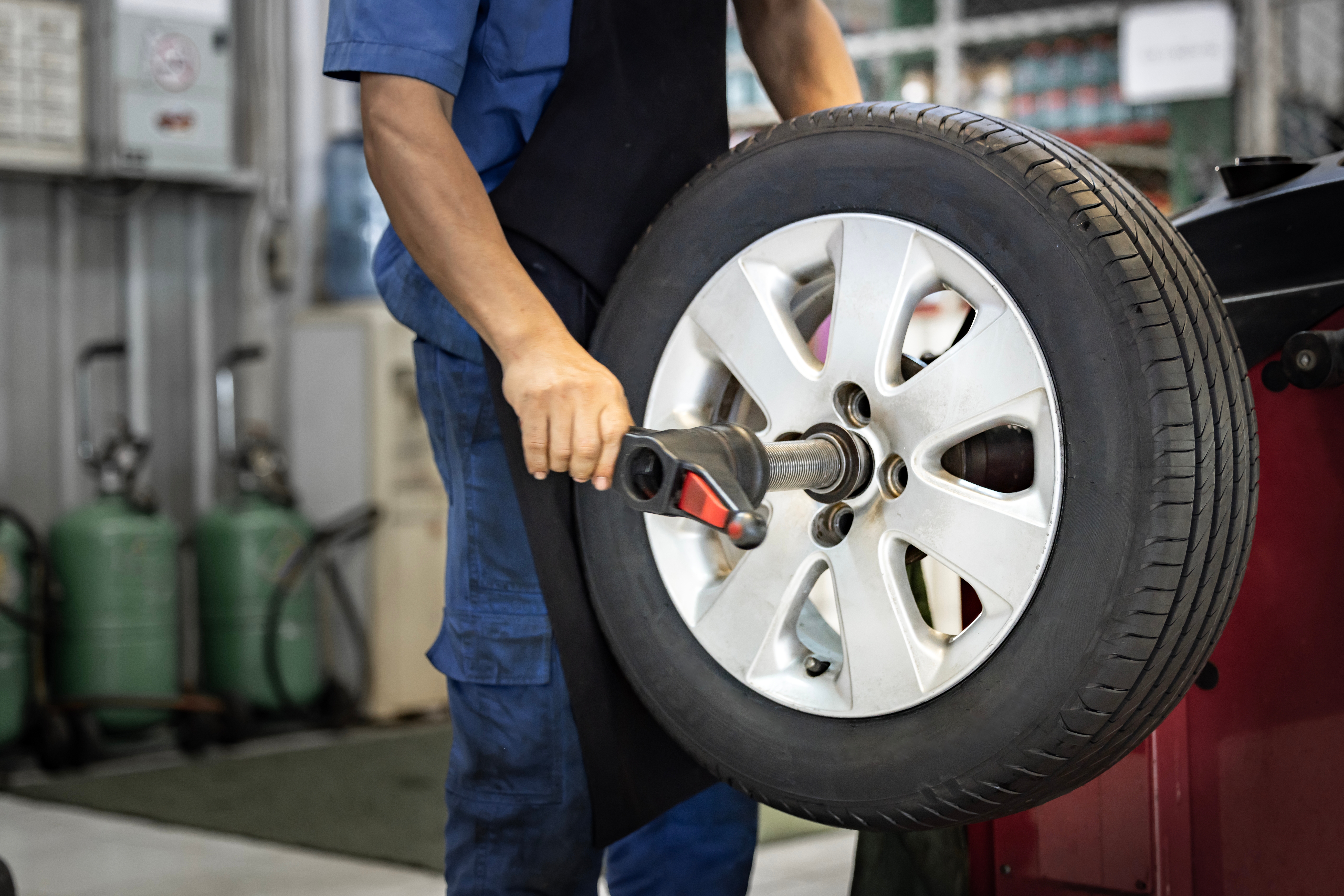 Auto Repair Tech Completing a Tire Rotation