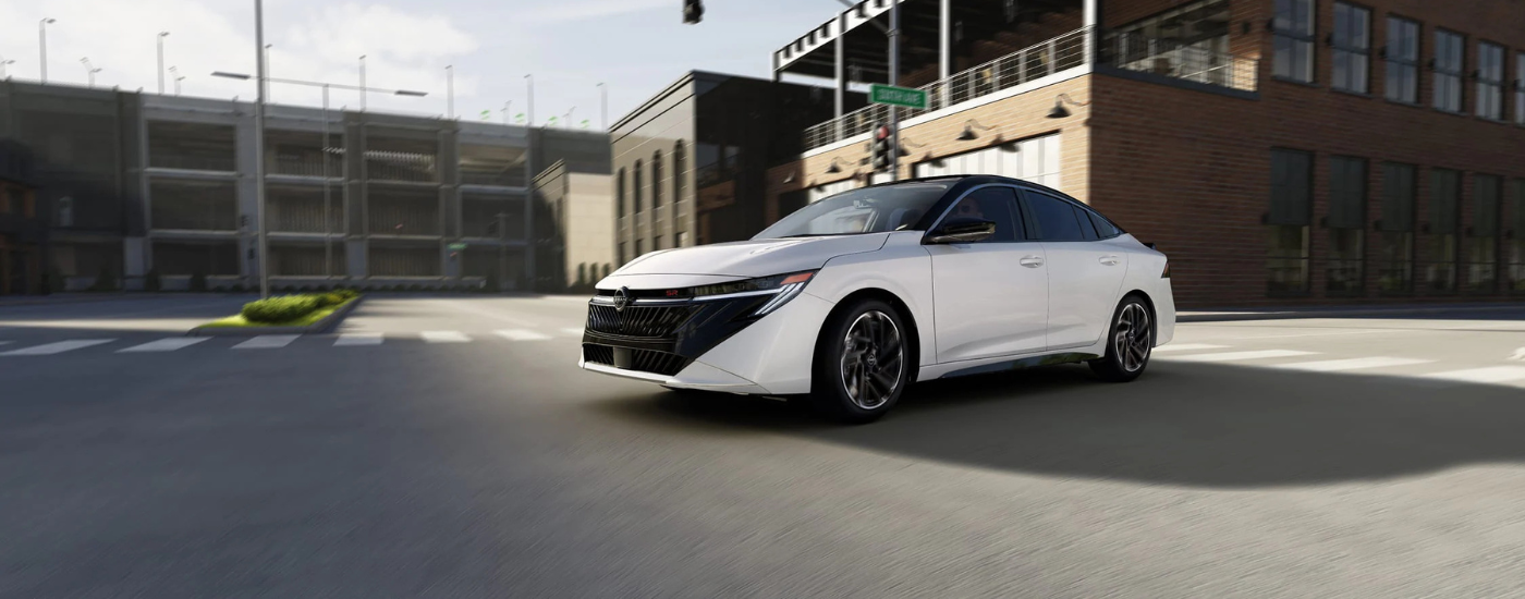 White 2026 Nissan Sentra rounding a corner