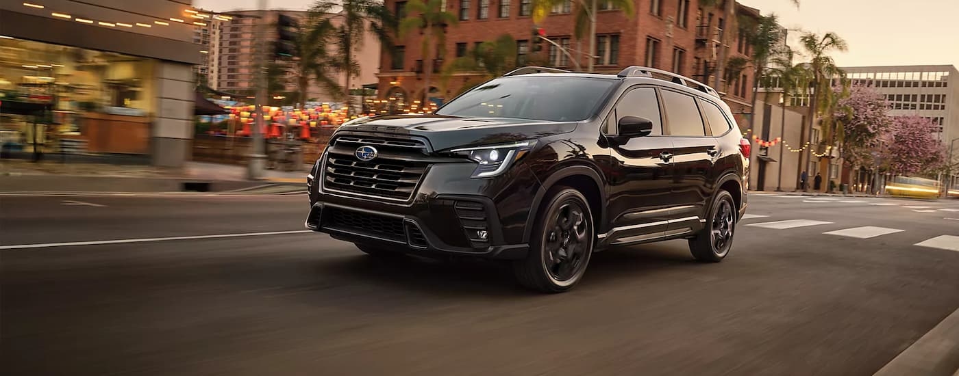 Black 2026 Subaru Ascent driving in a city