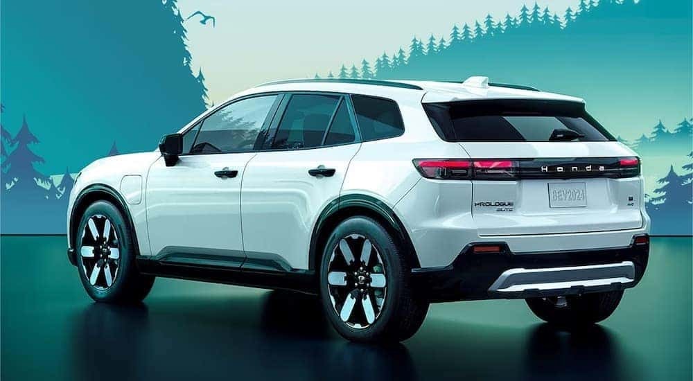 A white 2024 Honda Prologue is shown from the rear at an angle after leaving a dealer that has a Honda Prologue for sale.