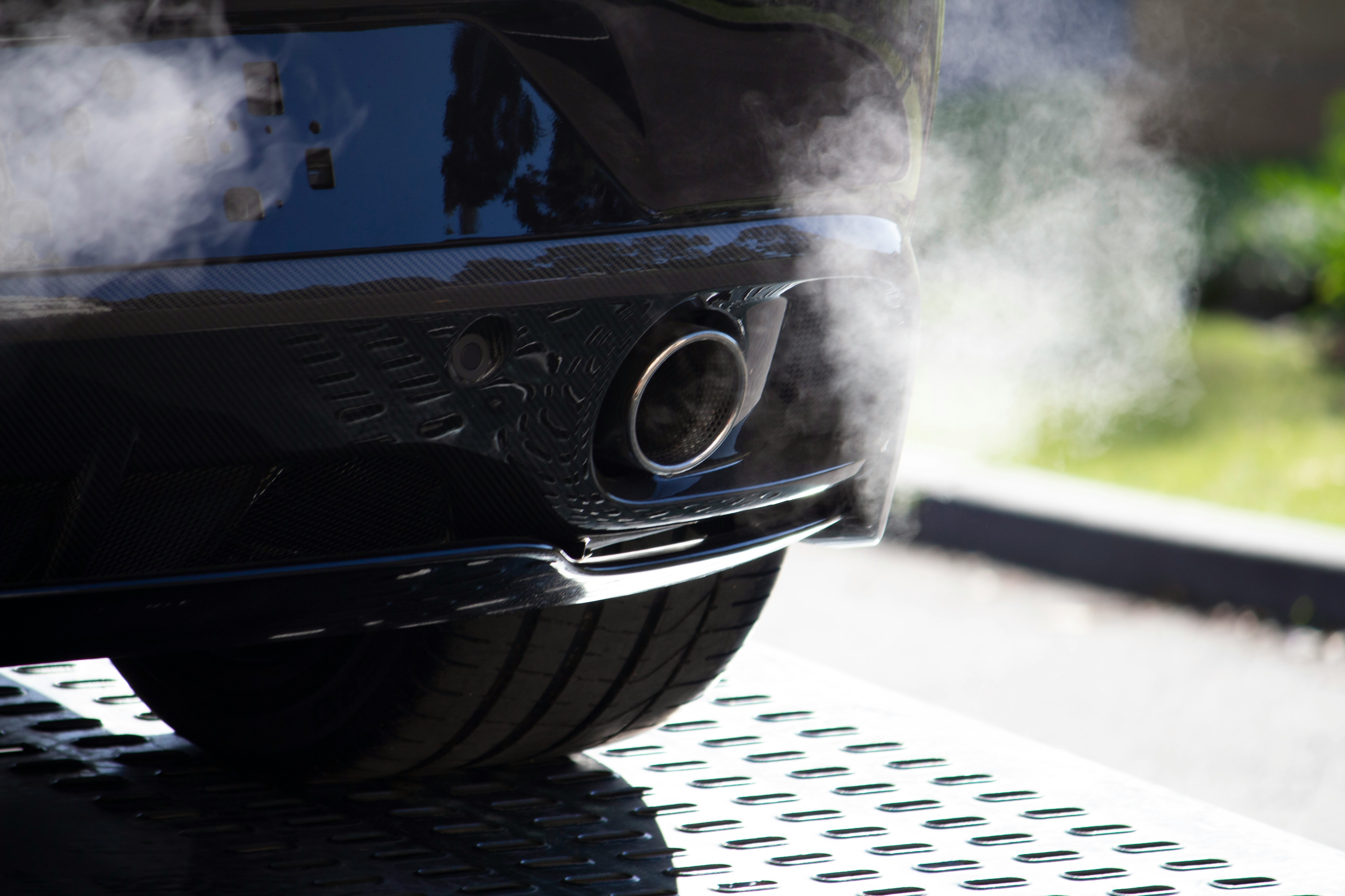 Rear view of a car emitting smoke