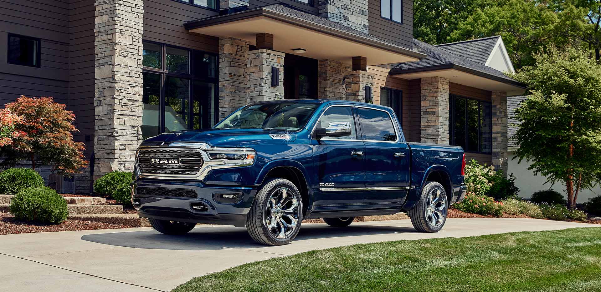 blue 2023 RAM 1500 parked in a driveway