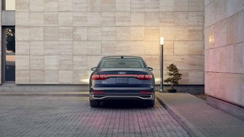 Rear view of an Audi A8 parked.