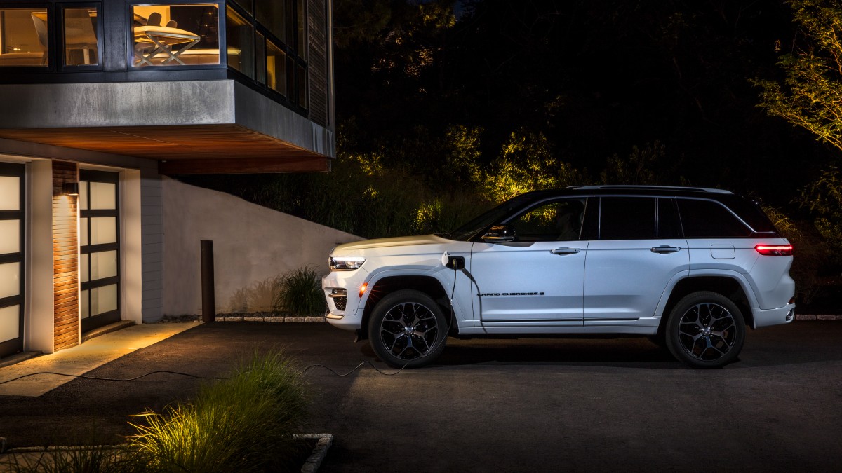 2025 Jeep Grand Cherokee 4xe Exterior Driver Side Profile while Home Charging