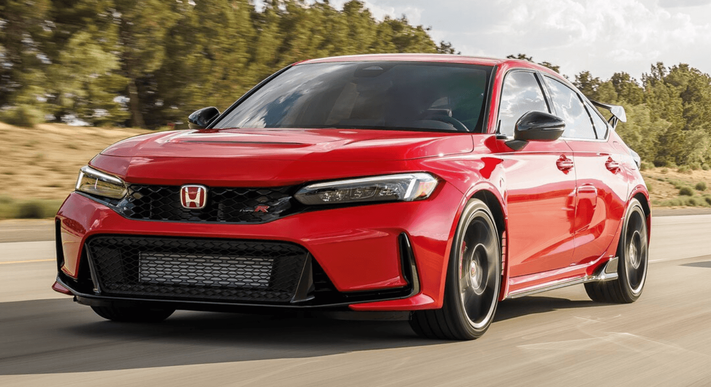 Red Honda Civic Type R driving on a road