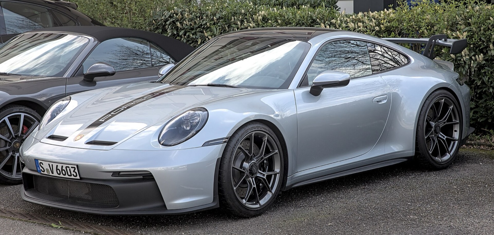 Silver Porsche 911 GT3 992 parked, front three-quarter