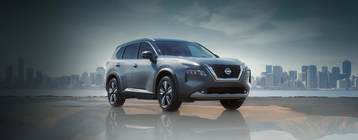 Grey 2023 Nissan Rogue overlooking a city 