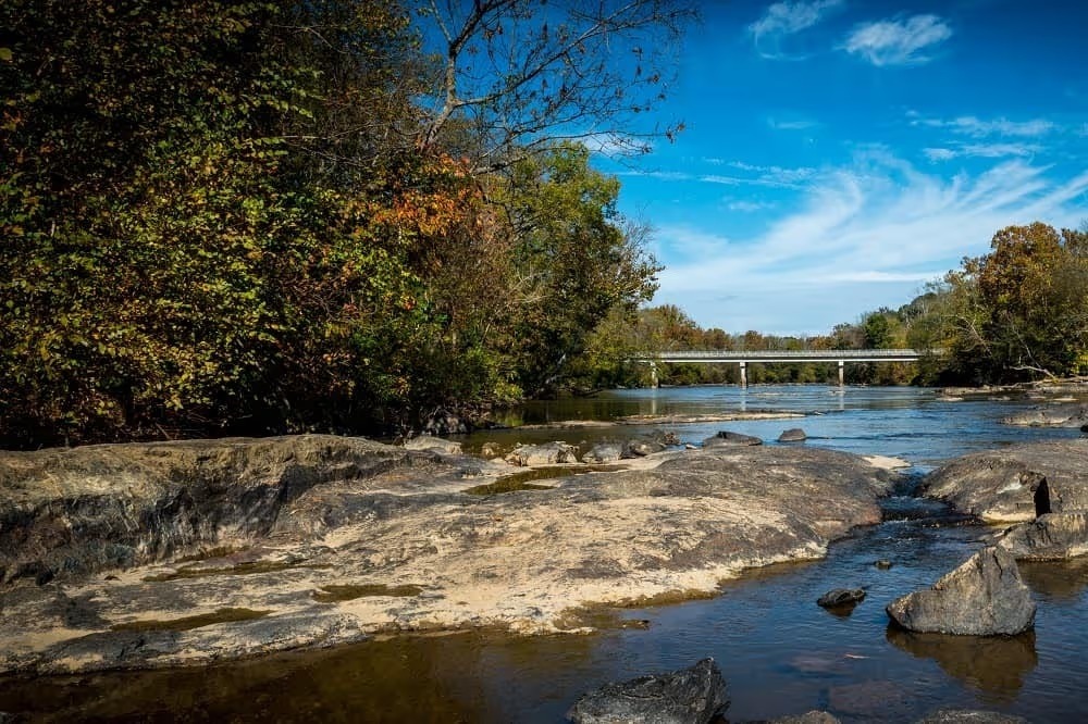 Rocky river running through autumn woods near Graham