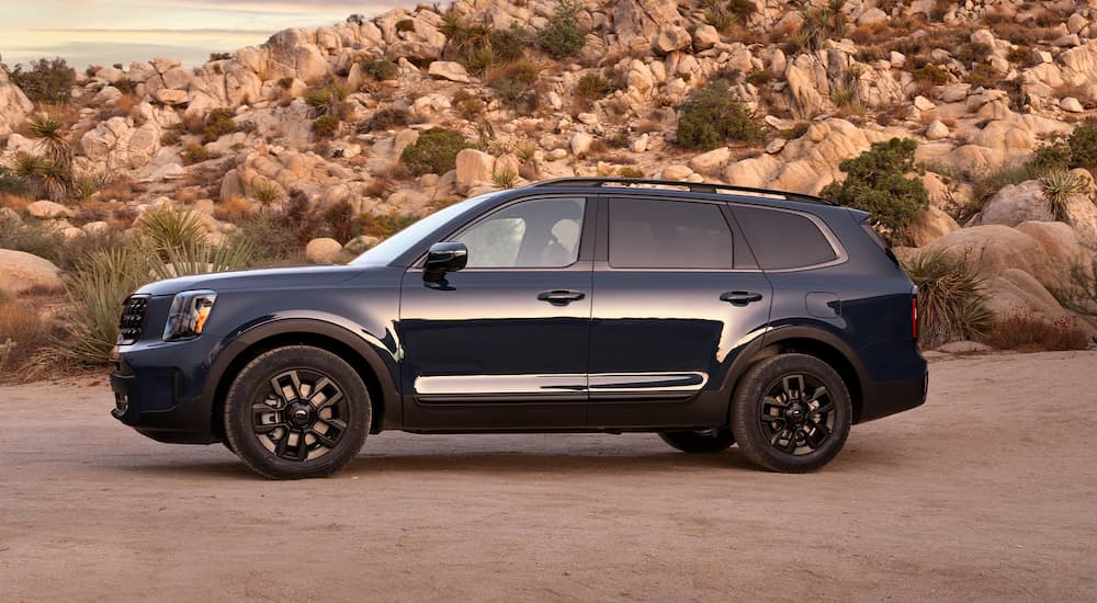 Blue 2025 Kia Telluride parked off-road
