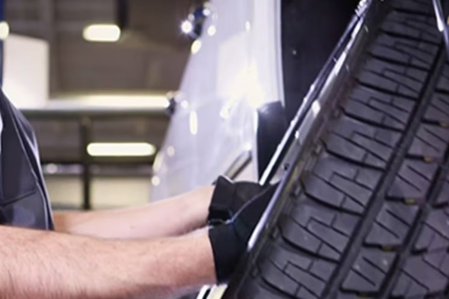 Chevy Master Technician Removing Tire Close Up