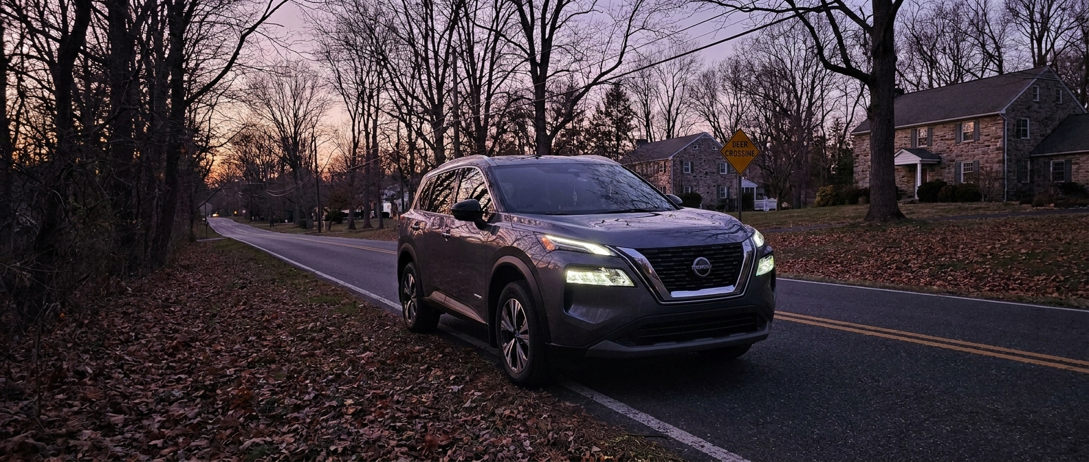 2026 Nissan Rogue Plug-In Hybrid on a suburban Pennsylvania road at dusk during fall deer season near Willow Grove