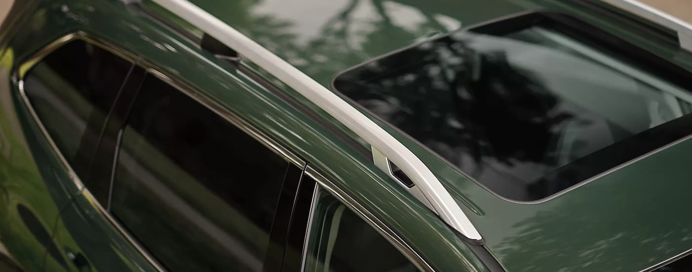 Close-up of the roof and sunroof on a green 2023 Subaru Forester