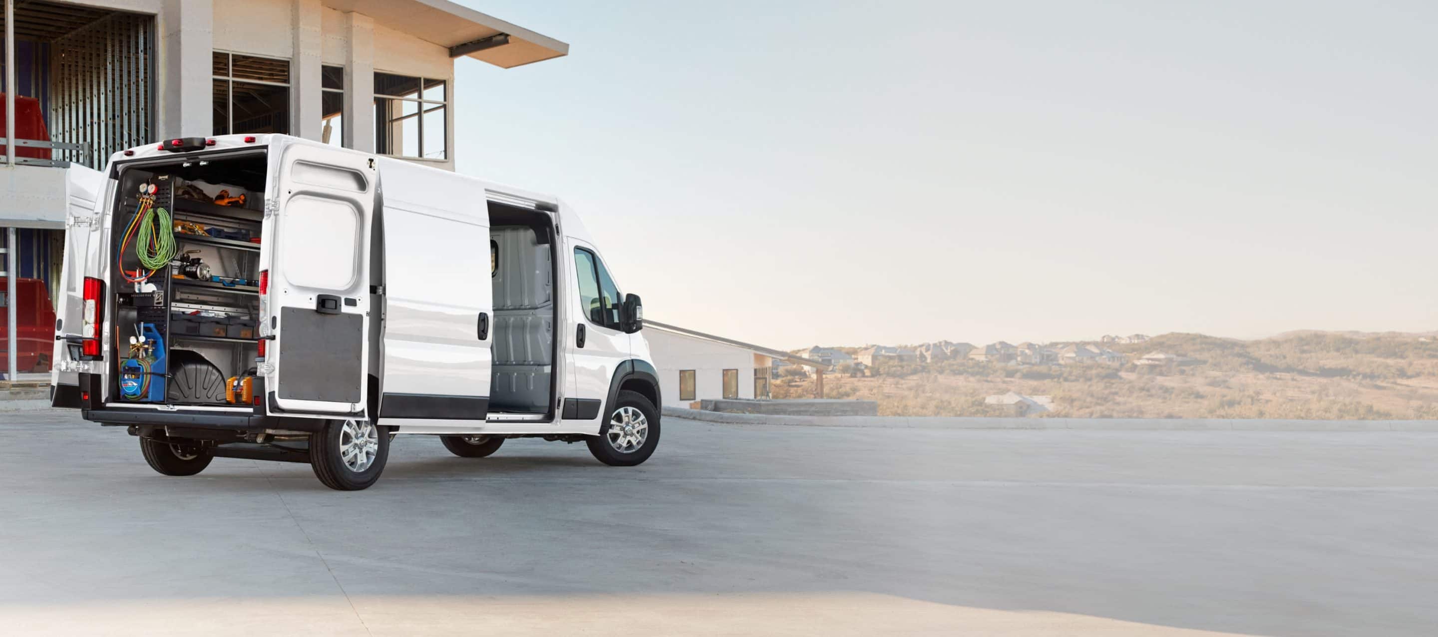 2026 RAM ProMaster cargo van with rear and side doors open, manufacturer image