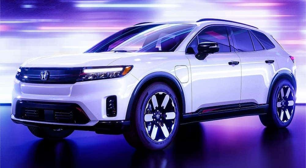A white 2024 Honda Prologue is shown from the front at an angle.