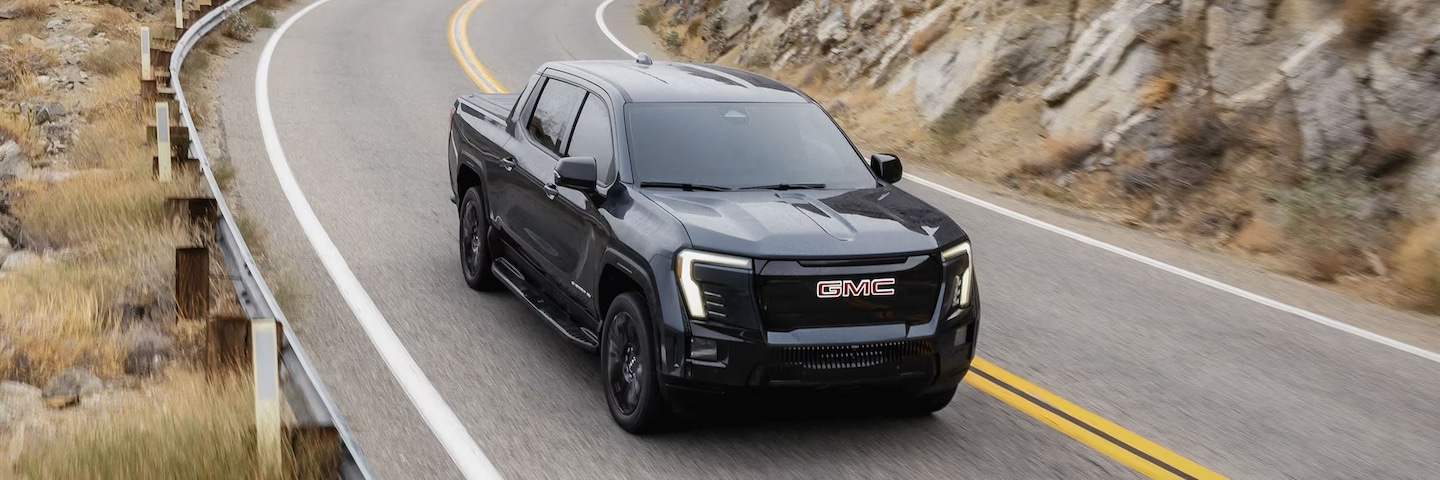 Hero Image of 2026 GMC Sierra EV and 2025 Rivian R1T