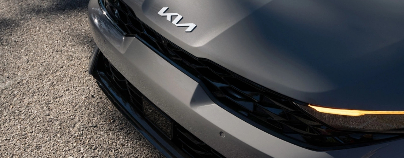 Hood and headlights on a grey 2025 Kia K5 at a Kia dealer near Elk River