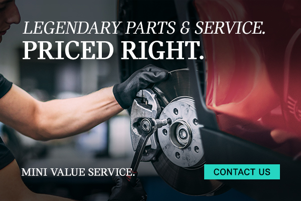 Service tech working on MINI brakes.