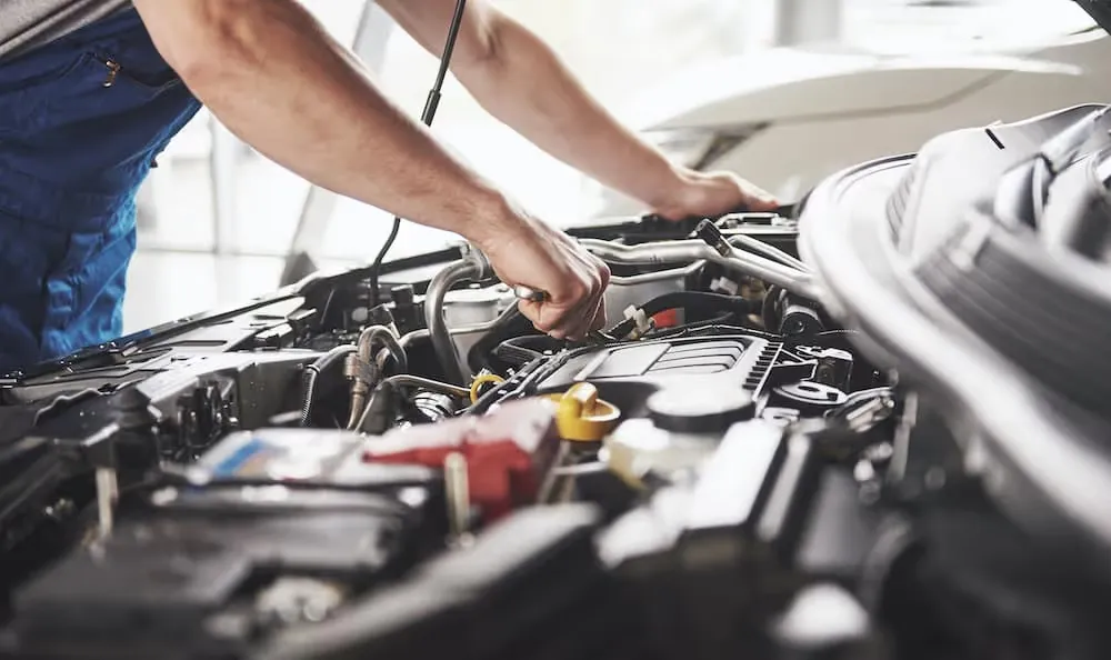 Technician working on engine