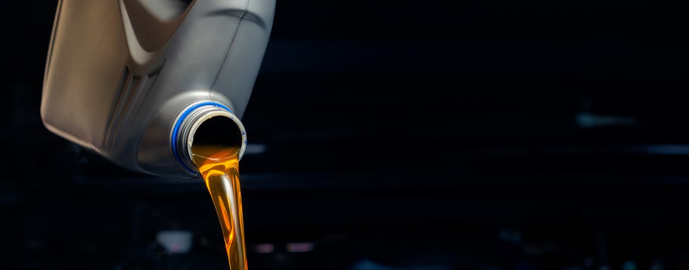 Oil being poured during an oil change