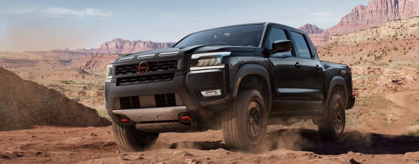 A black 2022 Nissan Frontier from the front.
