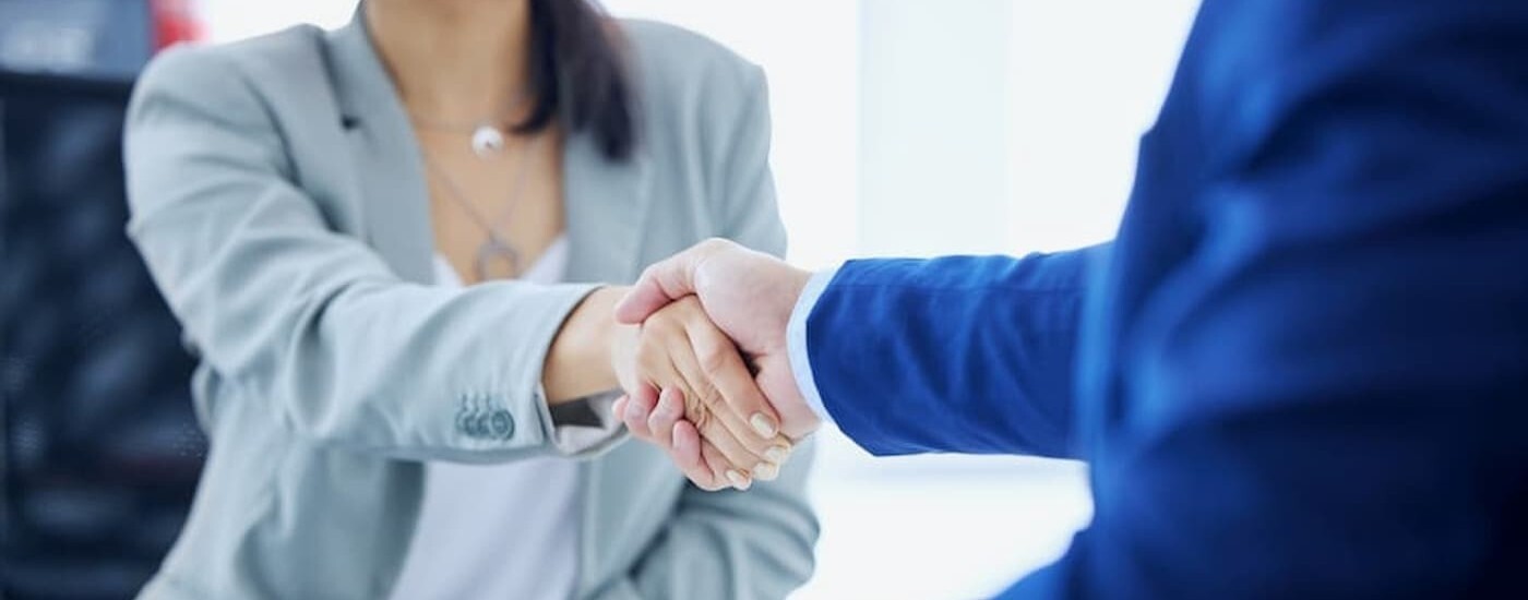 Two people shaking hands.
