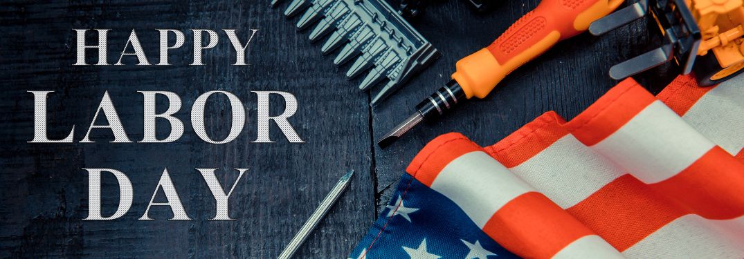 Tools and American Flag on Table with White Happy Labor Day Text