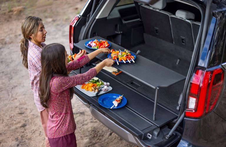 Mom and Daughter Getting Food from 2025 Ford Expedition Split Gate with Table