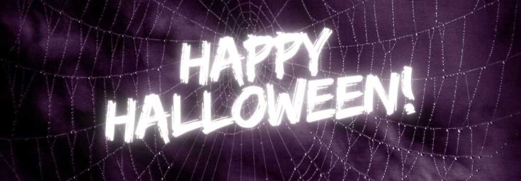 Spider Web on Purple Background with Happy Halloween Text