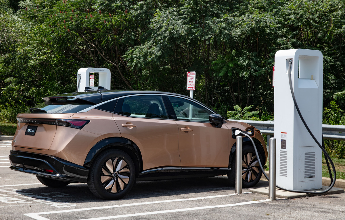 2023 Nissan Ariya being charged at an electric-vehicle charging station | Nissan Reno Nv