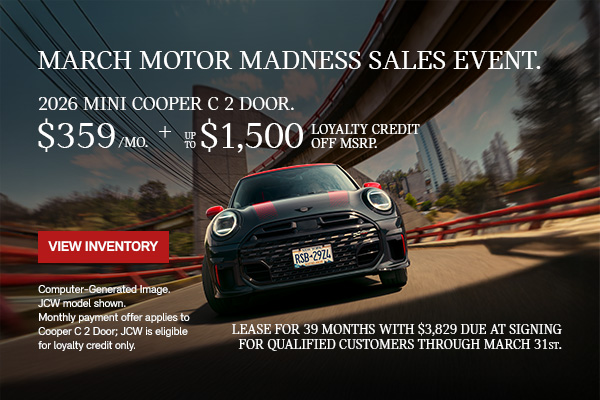 Front View of JCW driving on a city street.