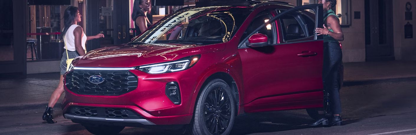 Red 2025 Ford Escape on a City Street at Night