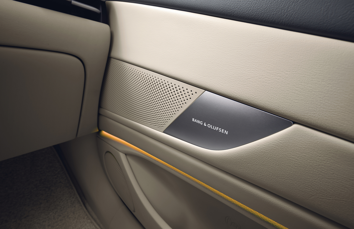 Close up of Bang & Olufsen speaker system in beige interior door of Genesis G80