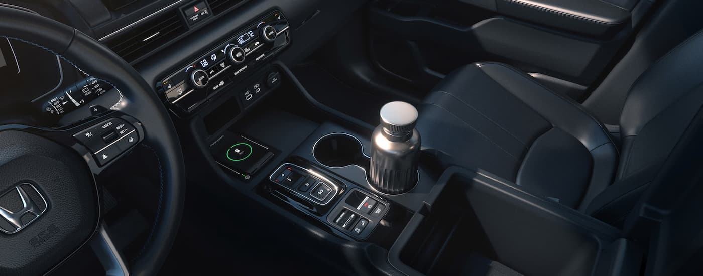 Center console and front black leather seats in a 2025 Honda Pilot