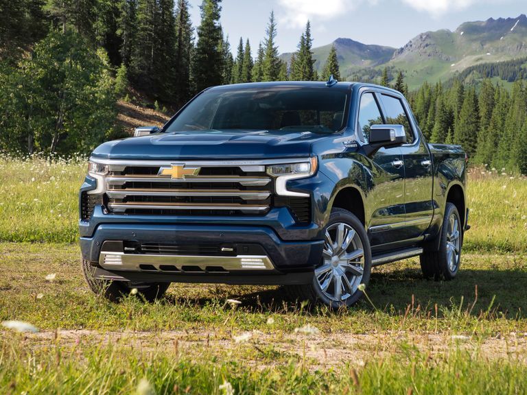  A navy 2023 Chevrolet Silverado 1500 parked in the forest.