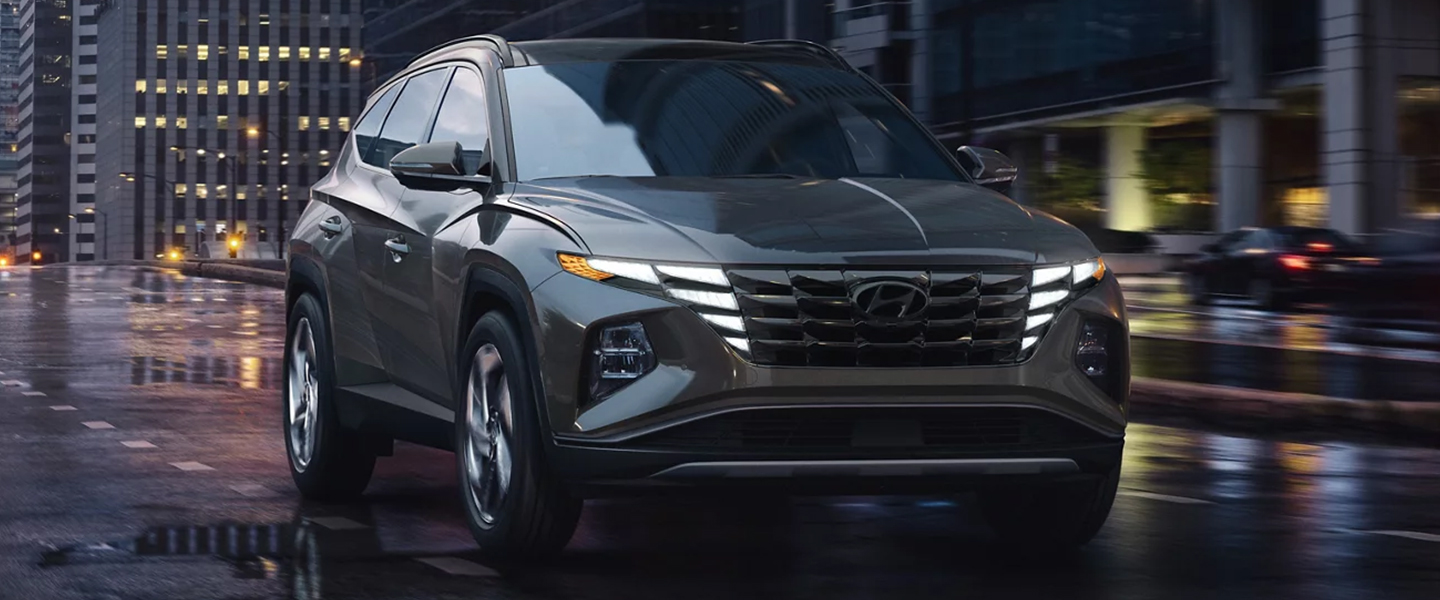 a gray suv driving in the city