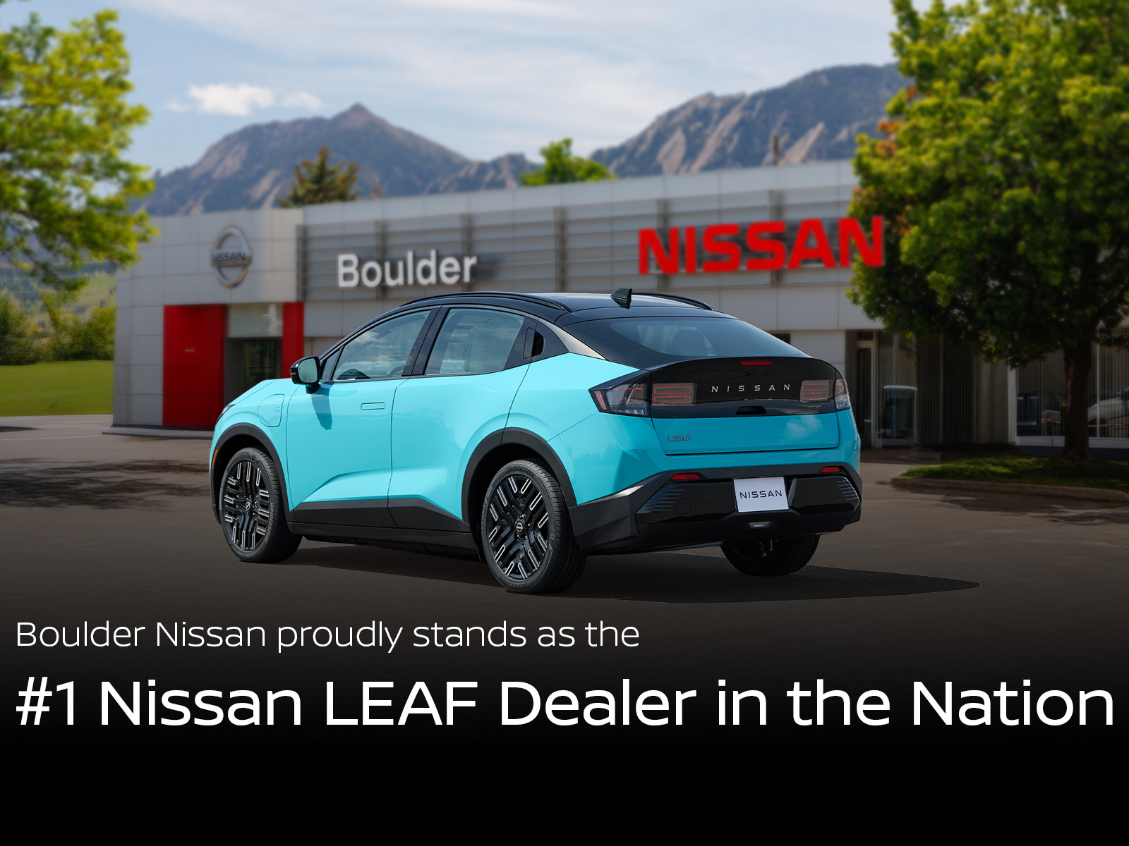 Boulder Nissan dealership with the next generation Nissan LEAF outside of the store. 