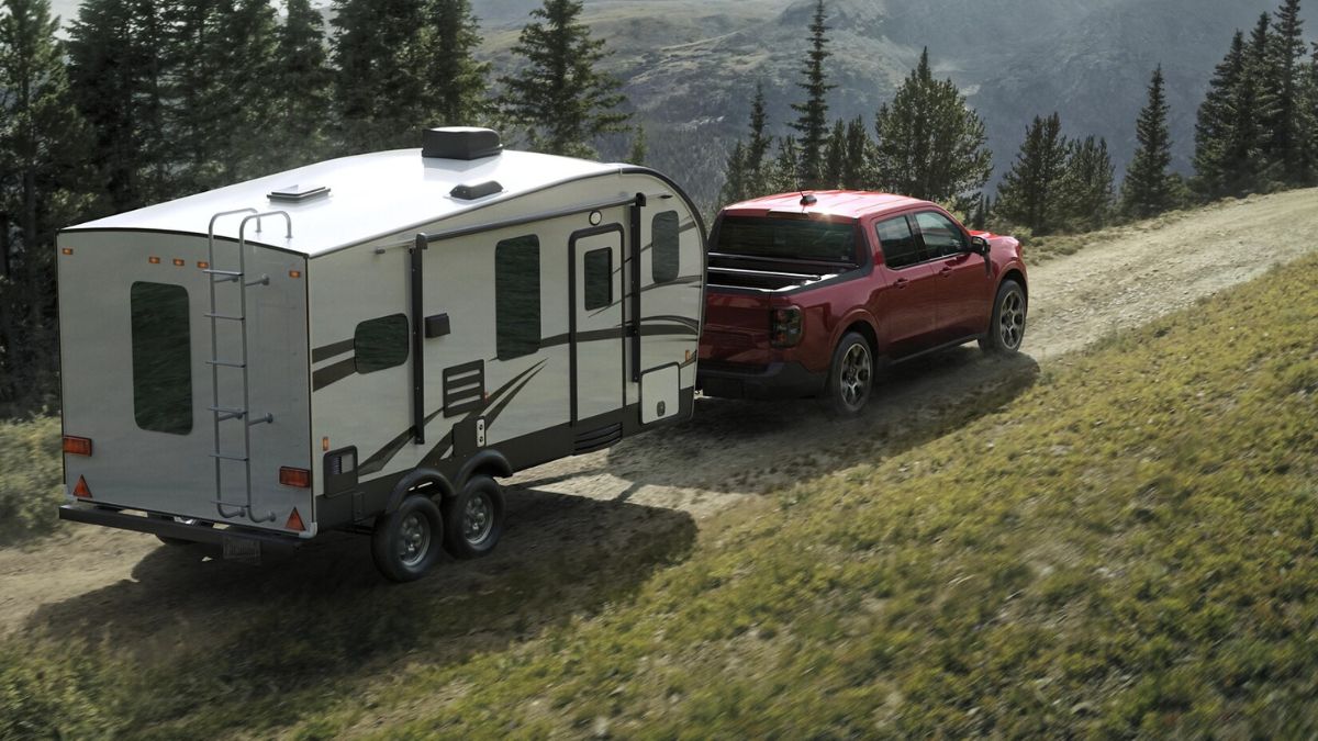Red 2025 Ford Maverick Towing a Camper Trailer