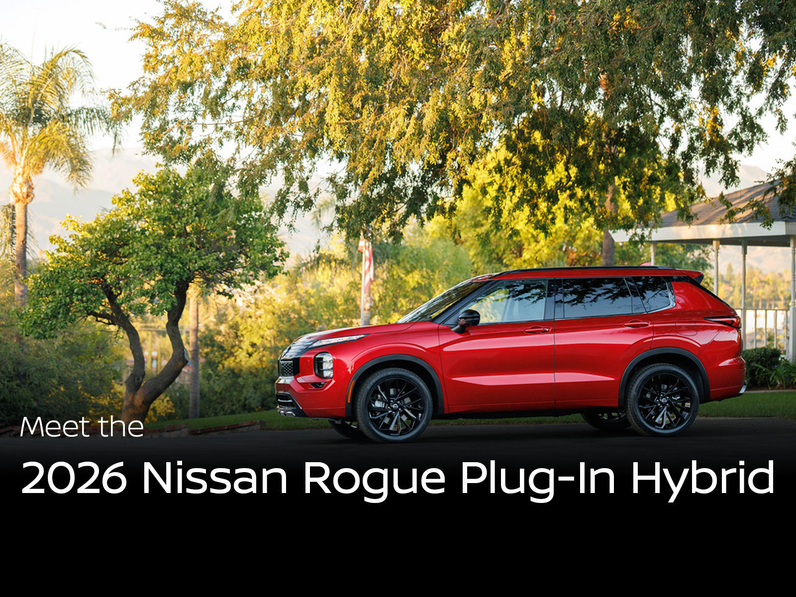 Red 2026 Nissan Rogue Plug in Hybrid shown in a side profile view, parked on a shaded residential street with trees and soft afternoon light in the background. The SUV features black wheels, sculpted body lines, and modern LED lighting that highlight its new plug in hybrid design.