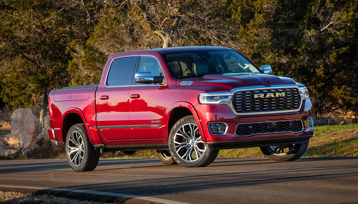 A red  truck sitting in the road.