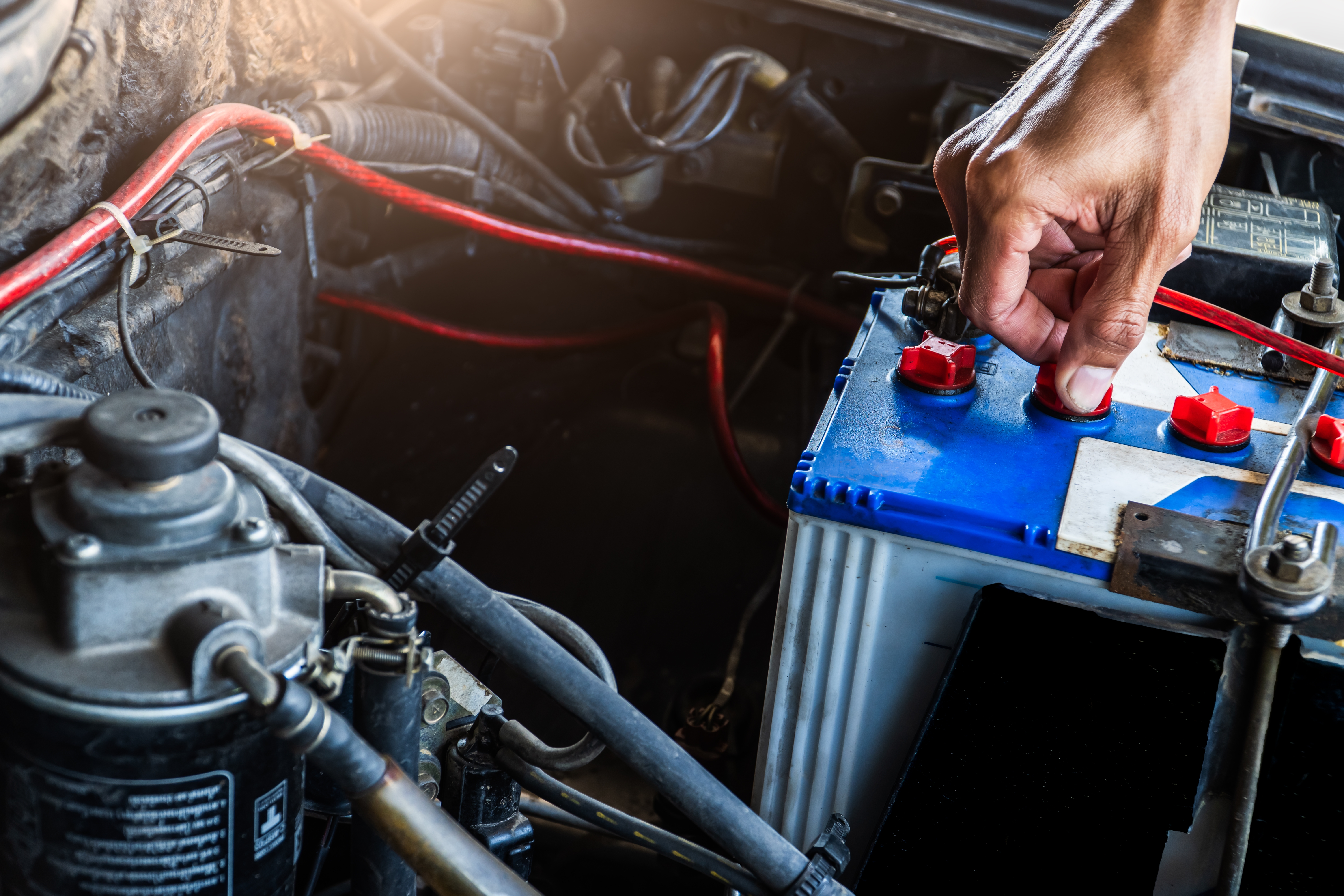 Technician performing a battery load test on a Chevrolet Equinox at Don Hattan in Park City, KS