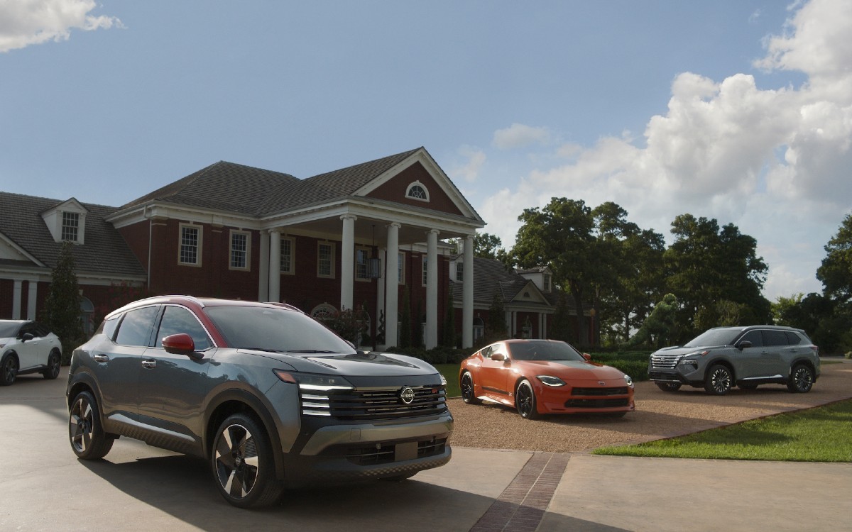 Nissan Models in Front of Nice House