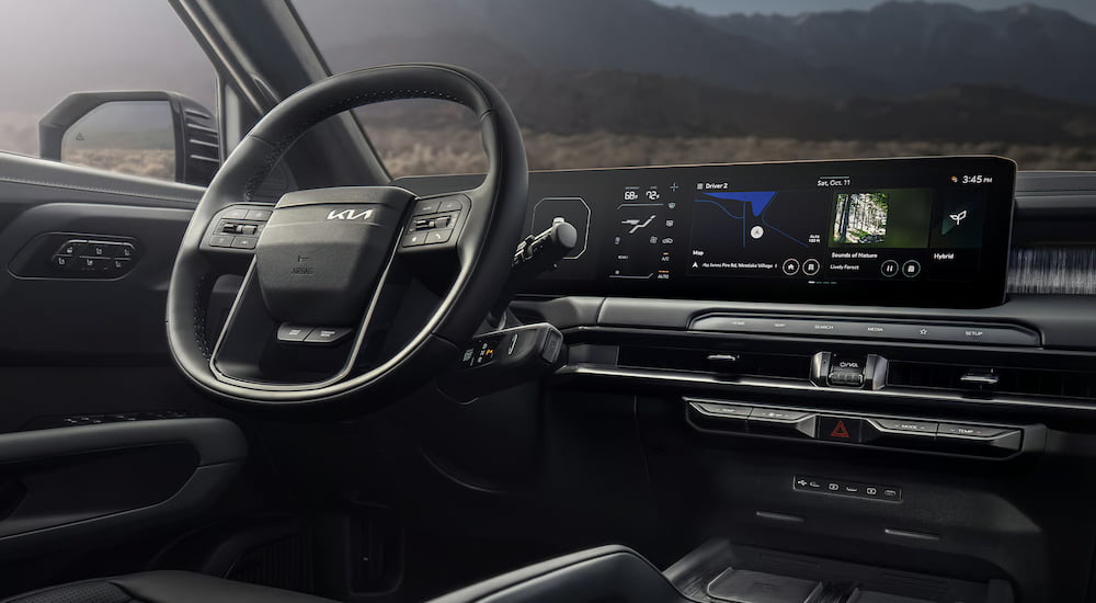 The steering wheel and dashboard in the interior of a 2027 Kia Telluride.