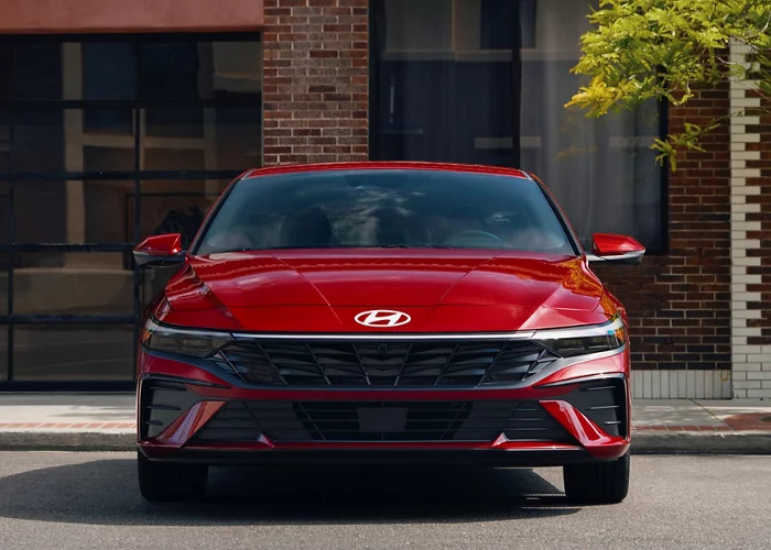 A red Hyundai Elantra parked.