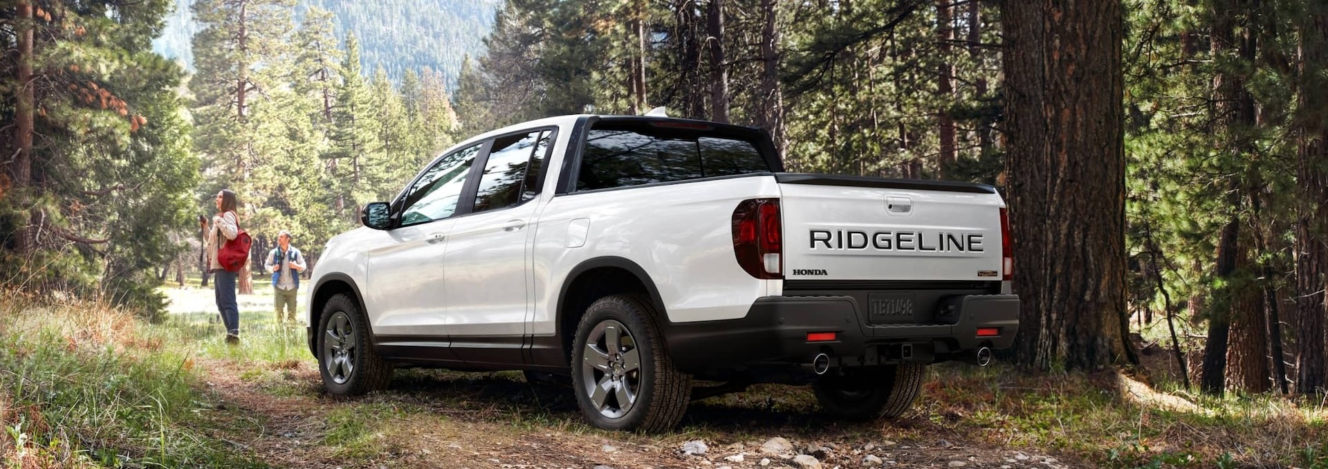 2025 Honda Ridgeline TrailSport shown in Platinum White Pearl with Tailgate Blackout Package