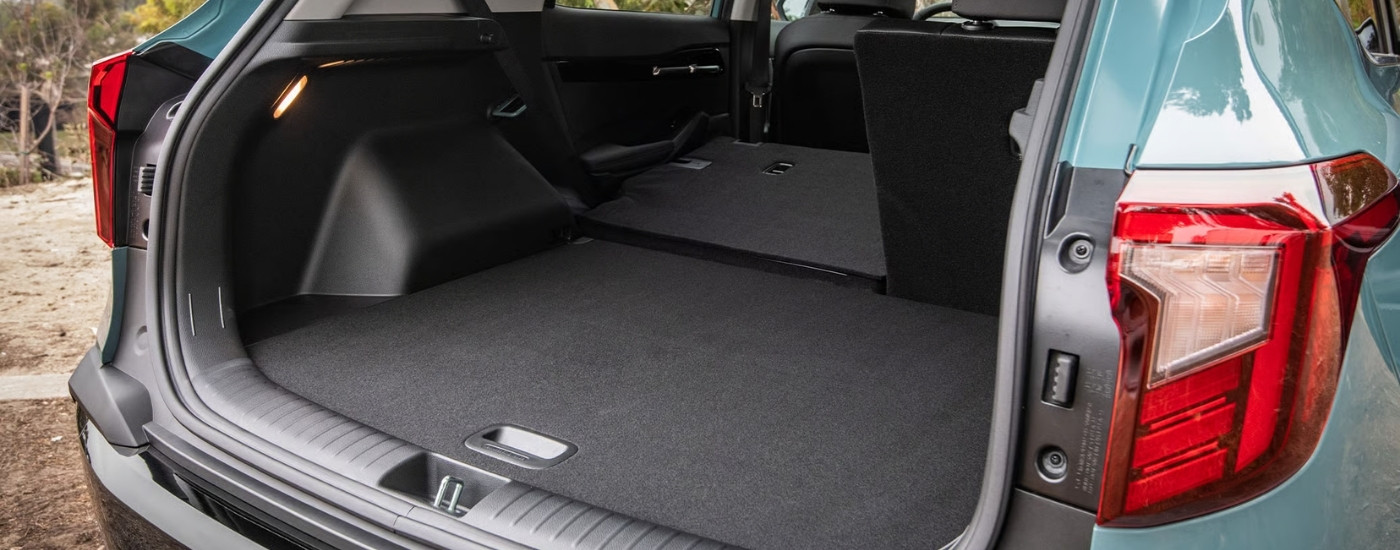 Rear cargo area in a green 2026 Kia Seltos