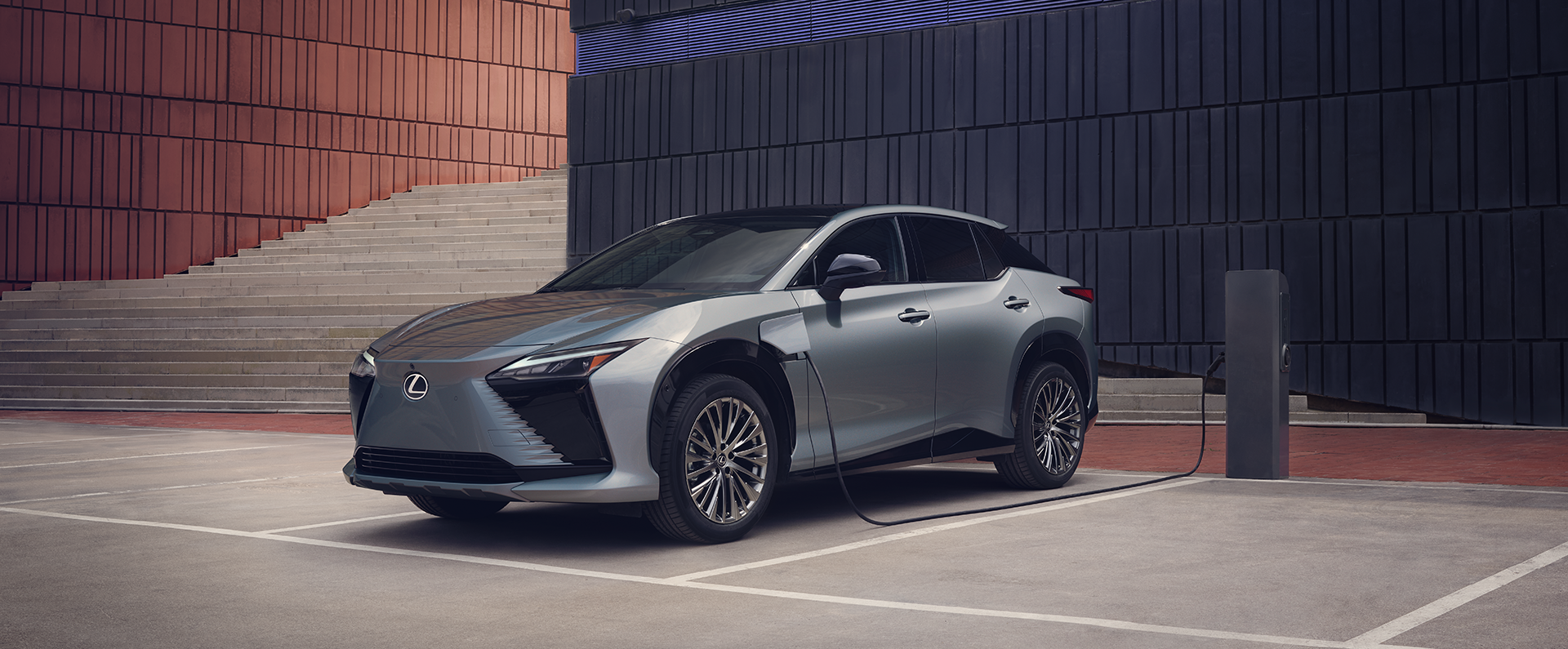 Lexus Electrified line of vehicles including RX 500h, NX PHEV, and RZ models shown.  