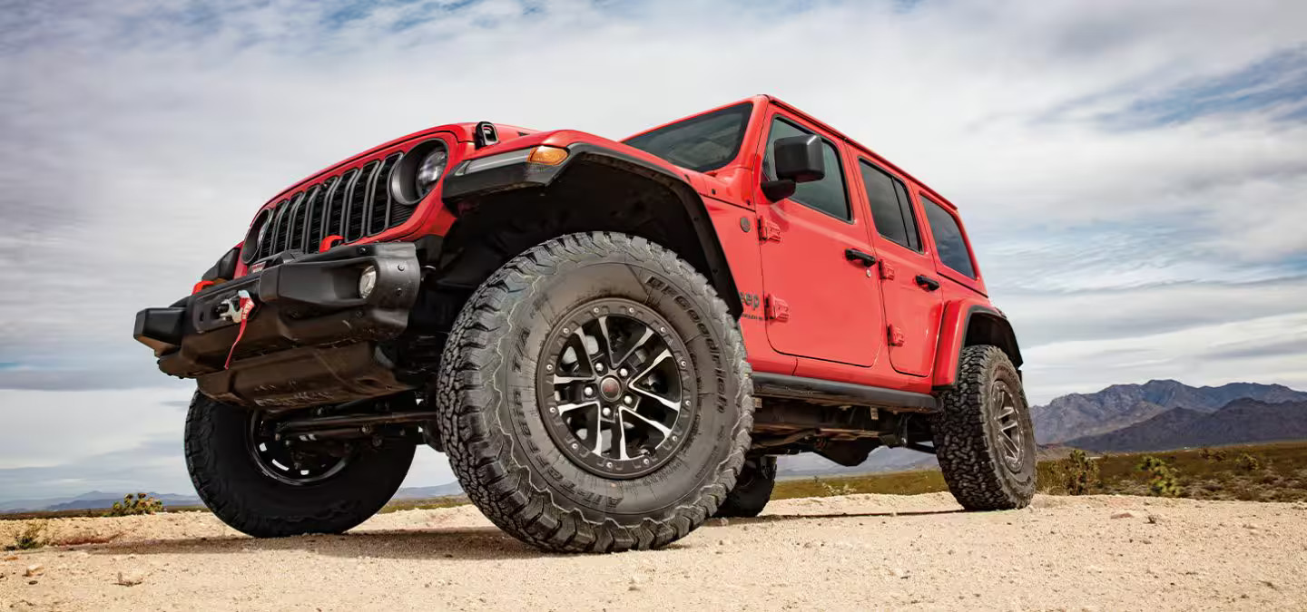 A red jeep sitting parked.